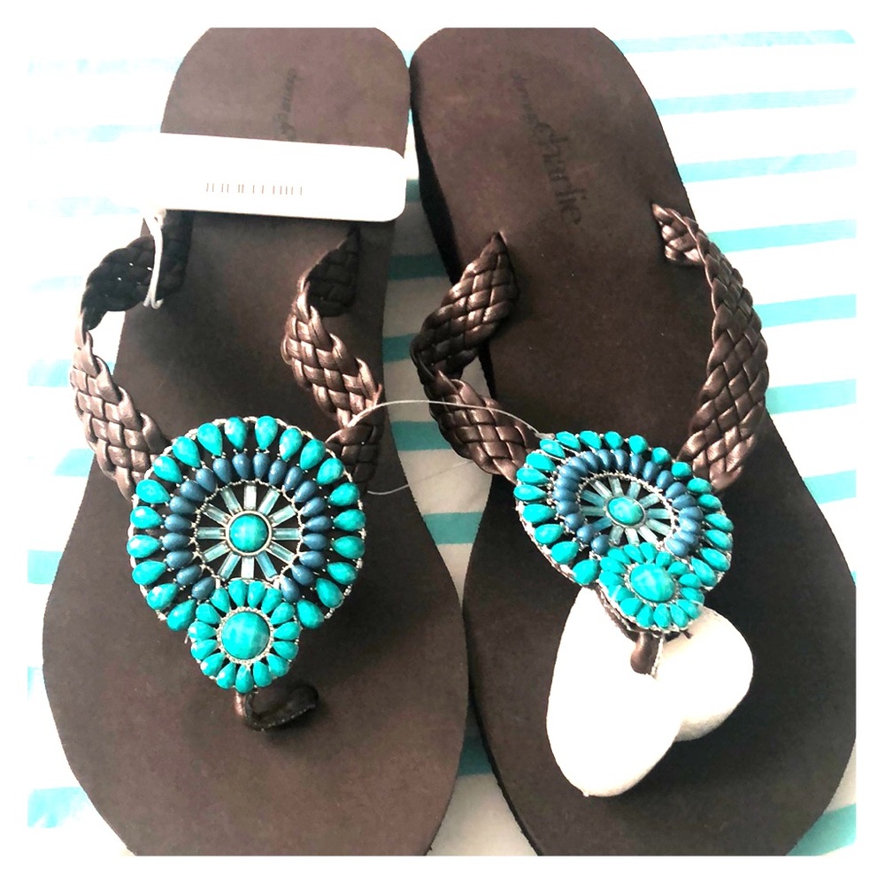 Brown sandals with teal stones.